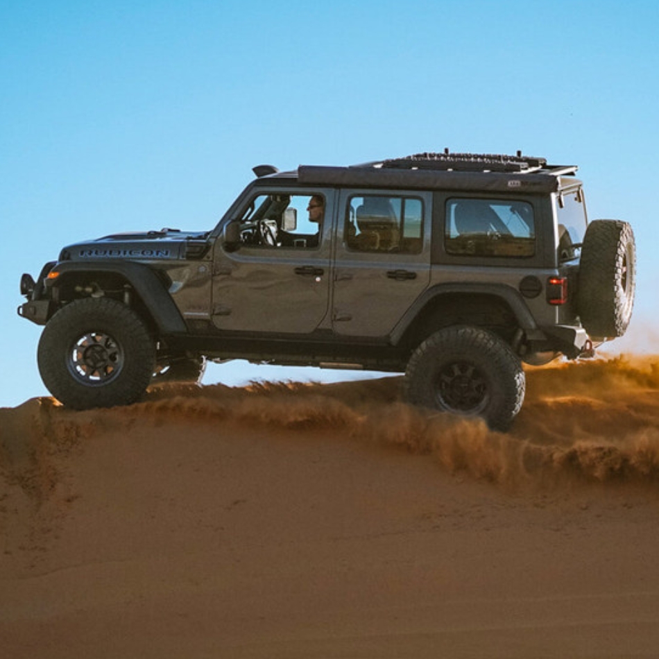 Jeep in sand dune