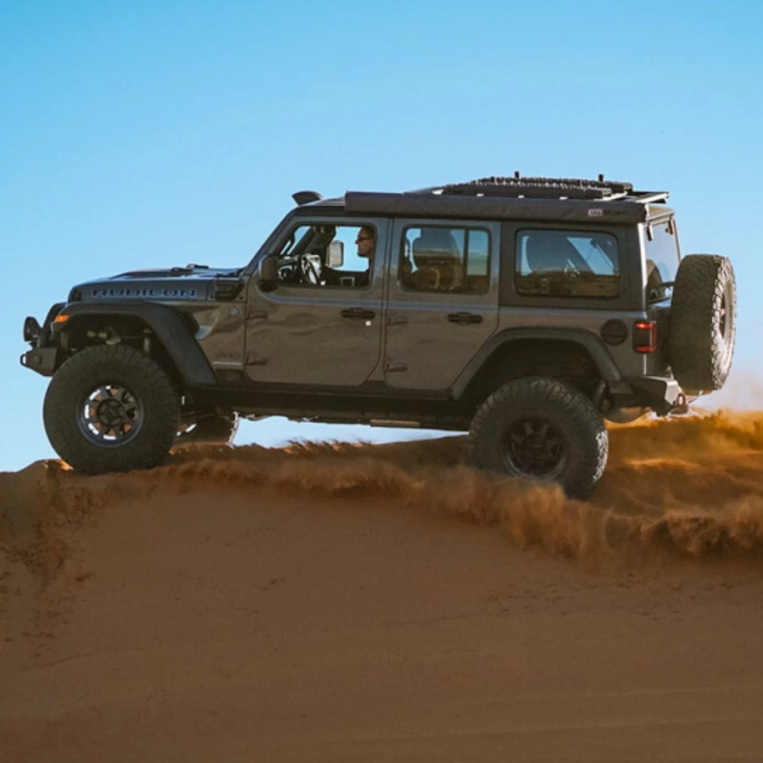 Jeep in sand dune